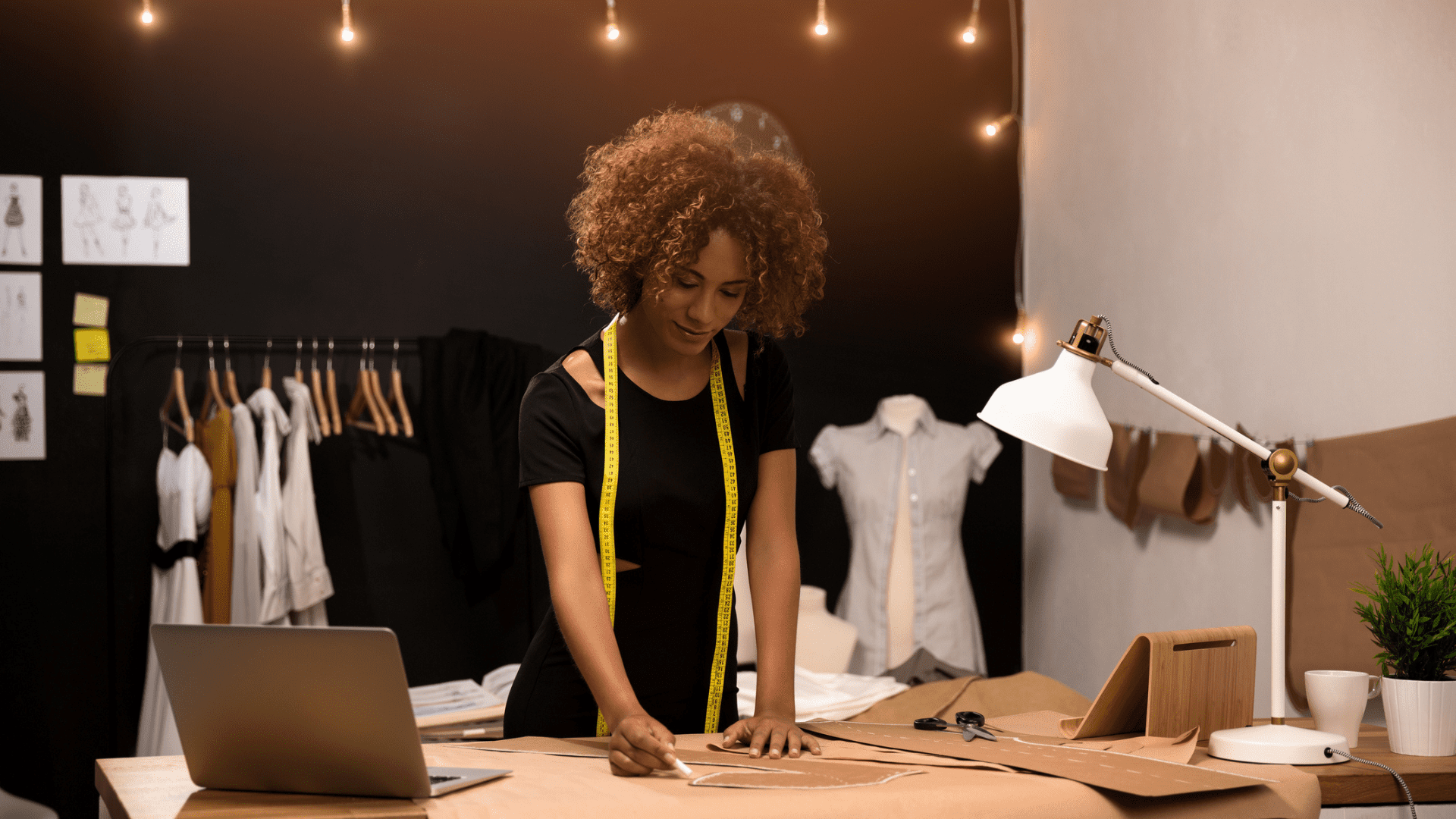 Small business owner looking at a sewing pattern on a table