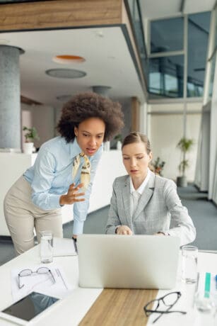 Women entrepreneurs reviewing their small business loans applications.